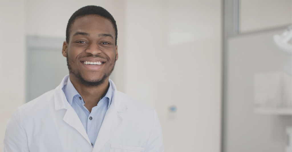 Dental professional looking at camera and smiling