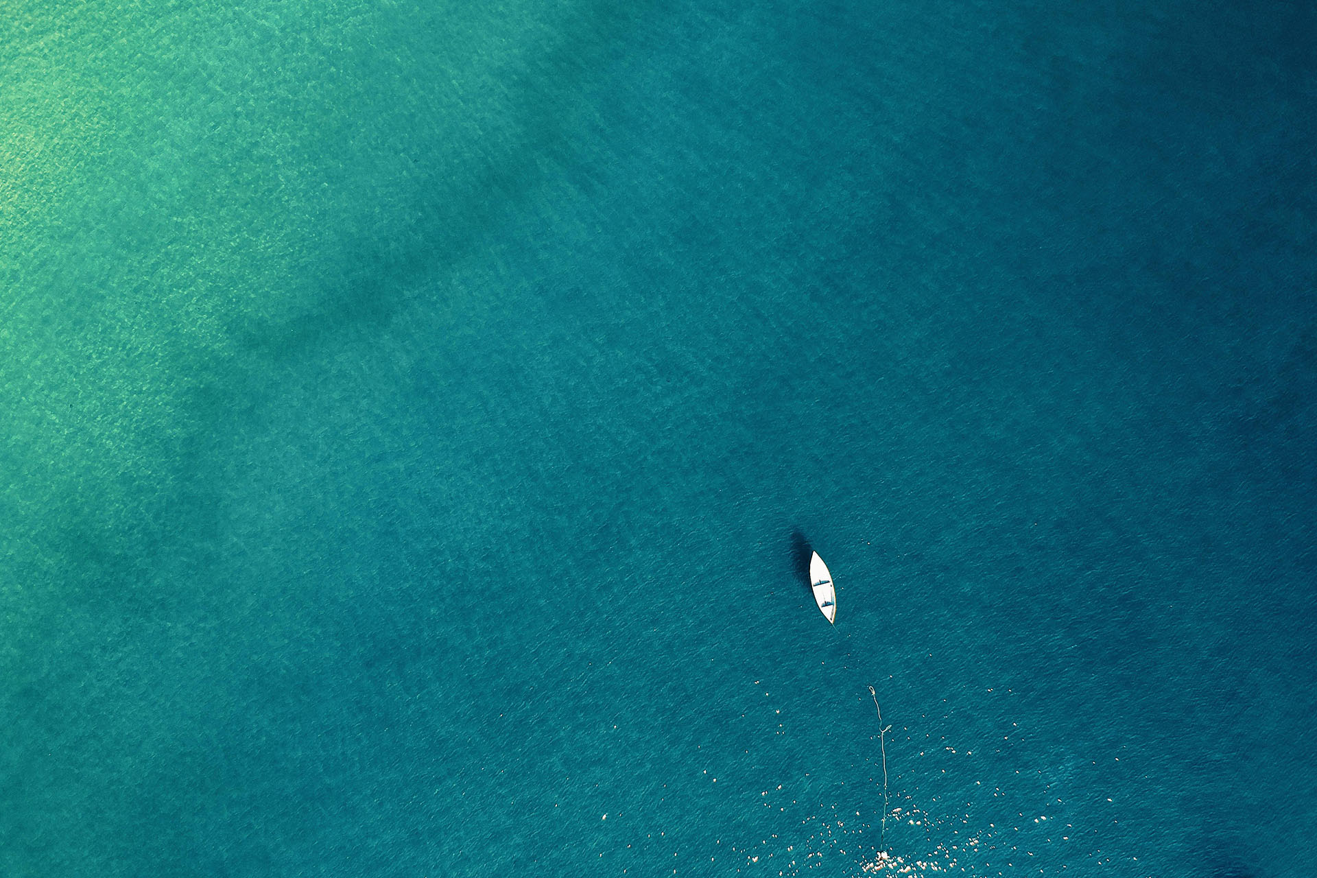 Boat on bright and clear open water